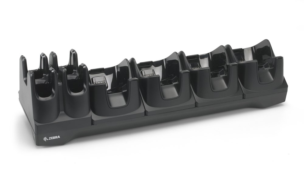A long black Zebra charging cradle with four bays shaped to take a TC8000
                  and four upright cups for spare batteries alongside them